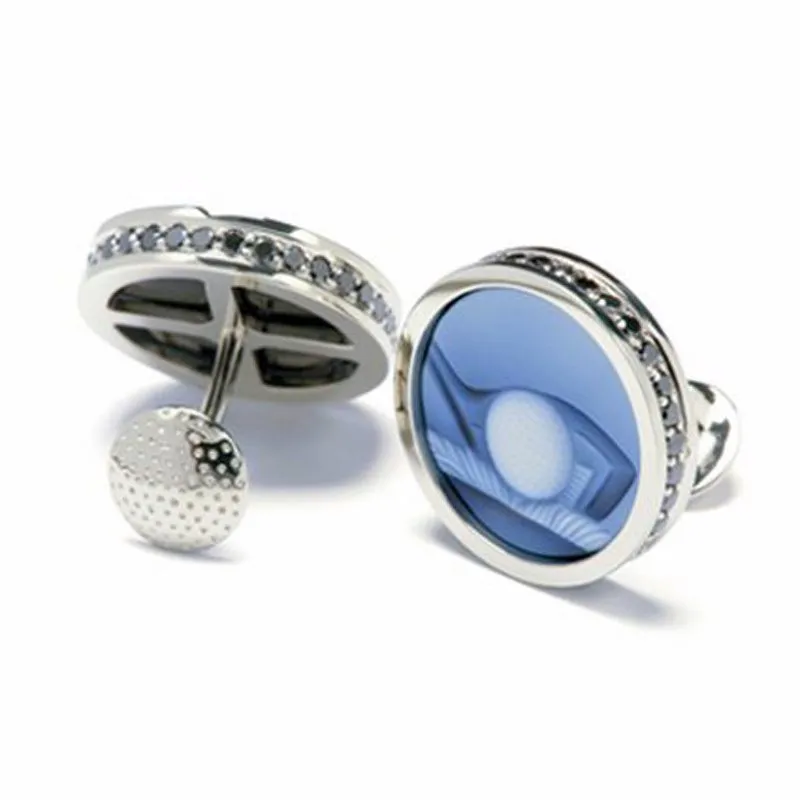 Golf-inspired white gold cufflinks featuring a blue design with a golf ball motif and diamond accents, showcasing sophisticated men's jewelry.