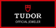 TUDOR logo with red shield emblem, representing official jeweler status, relevant to luxury watch offerings and the TUDOR Royal M28503-0005 model.