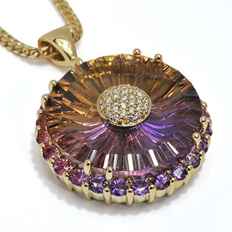 Masterpiece Ametrine pendant with gold setting and diamond accents, showcasing vibrant purple and yellow hues, featured in Coffin & Trout's fine jewelry collection.