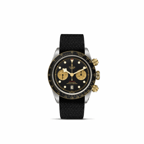 TUDOR Black Bay Chrono S&G watch featuring a 41 mm steel case with polished and satin finish, fixed yellow gold bezel, black dial with contrasting sub-counters, and black fabric strap.