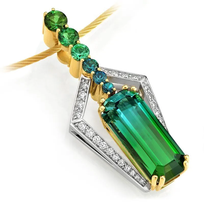 Orbit Reversible Diamond Pendant featuring a bi-color tourmaline centerpiece, accented with colored diamonds and set in gold, showcasing elegant craftsmanship.