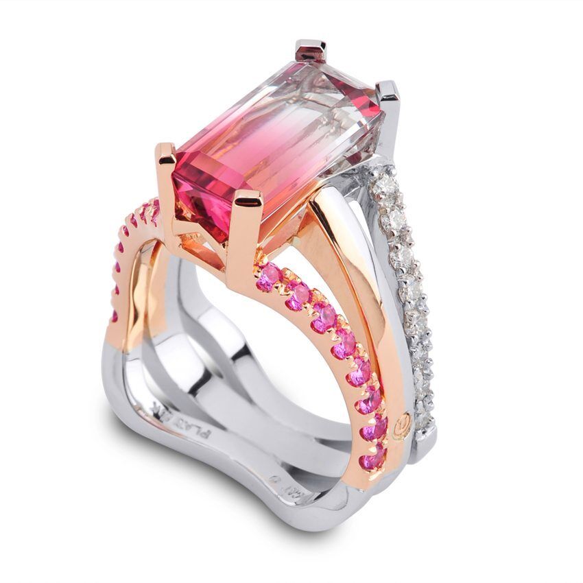 Interlace pink to white tourmaline ring featuring rose gold and platinum accents, embellished with pink gemstones and diamonds, showcasing luxury jewelry craftsmanship.