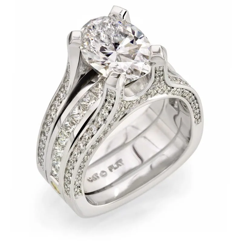 Platinum engagement ring featuring an oval diamond centerpiece and shimmering pavé-set diamonds along the band, symbolizing commitment and elegance in fine jewelry.