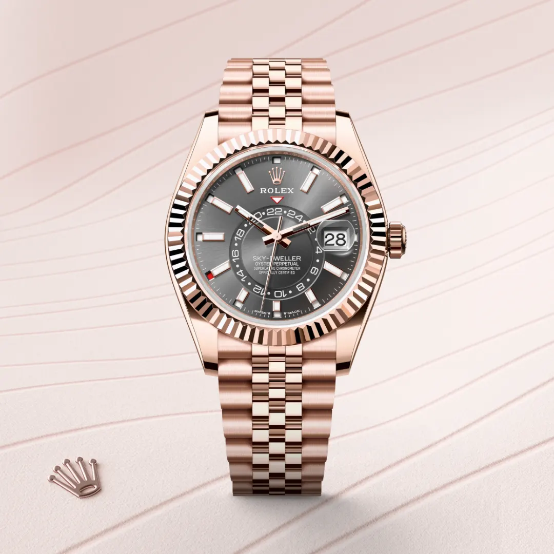 Rolex Sky-Dweller watch model M336935-0008 in Everose gold, featuring a gray dial, date function, and Oyster case, showcased on a textured background.